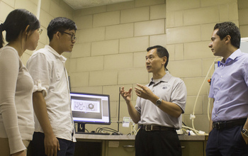 Pennsylvania State University's Ming Xiao in a discussion with graduate students.